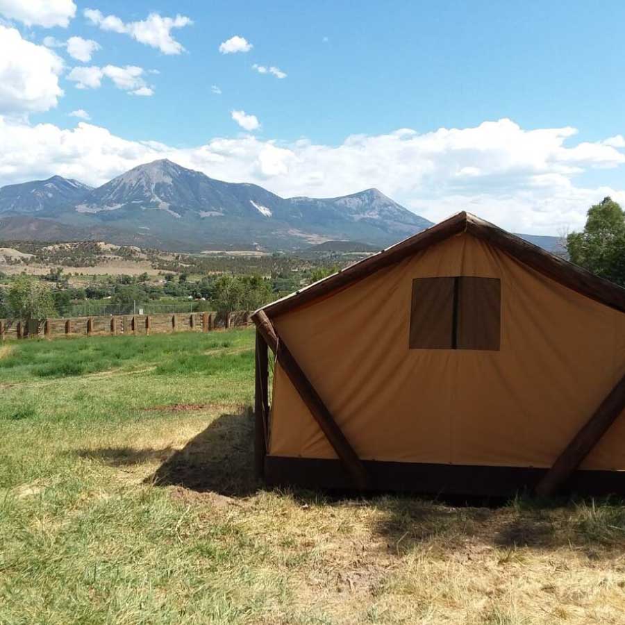 Ben's Quarters glamping tent exterior view of the mountains